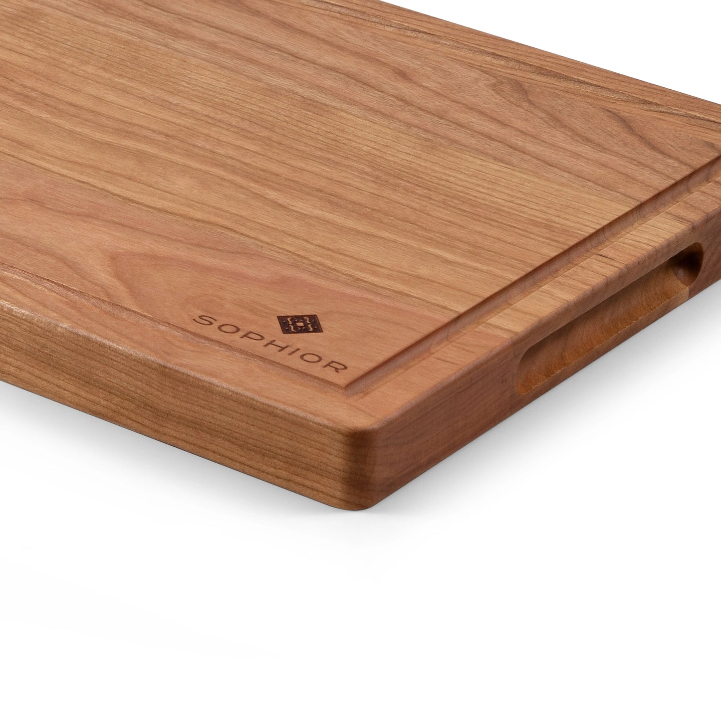 Houten Snijplank Kersen – 35×25×2,5 cm close-up van zijkant met sapgootje en handgreep