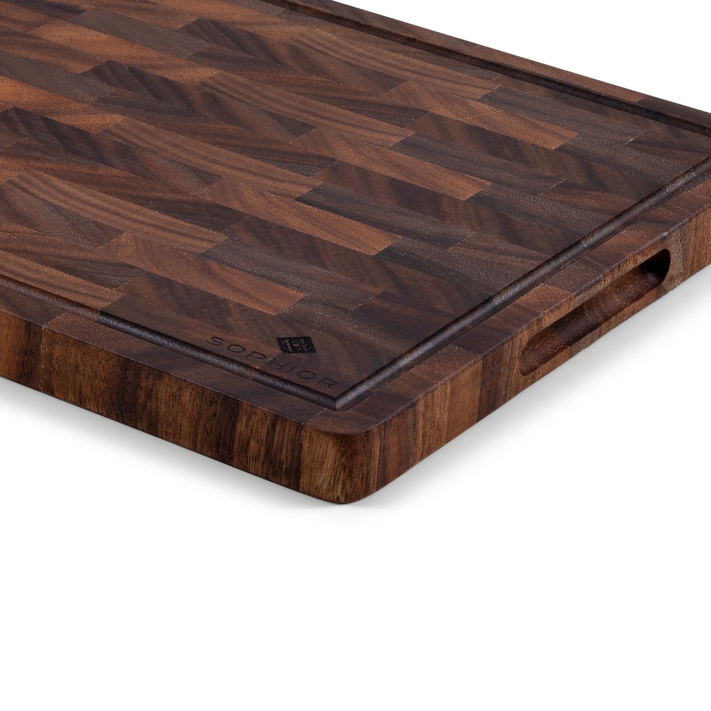 Houten Snijplank Walnoot Kopshout – 42×30×2,5 cm close-up van kopshout-patroon en SOPHIOR-logo